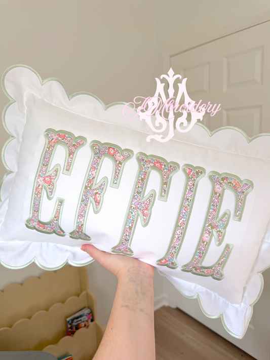 Scalloped nursery pillow