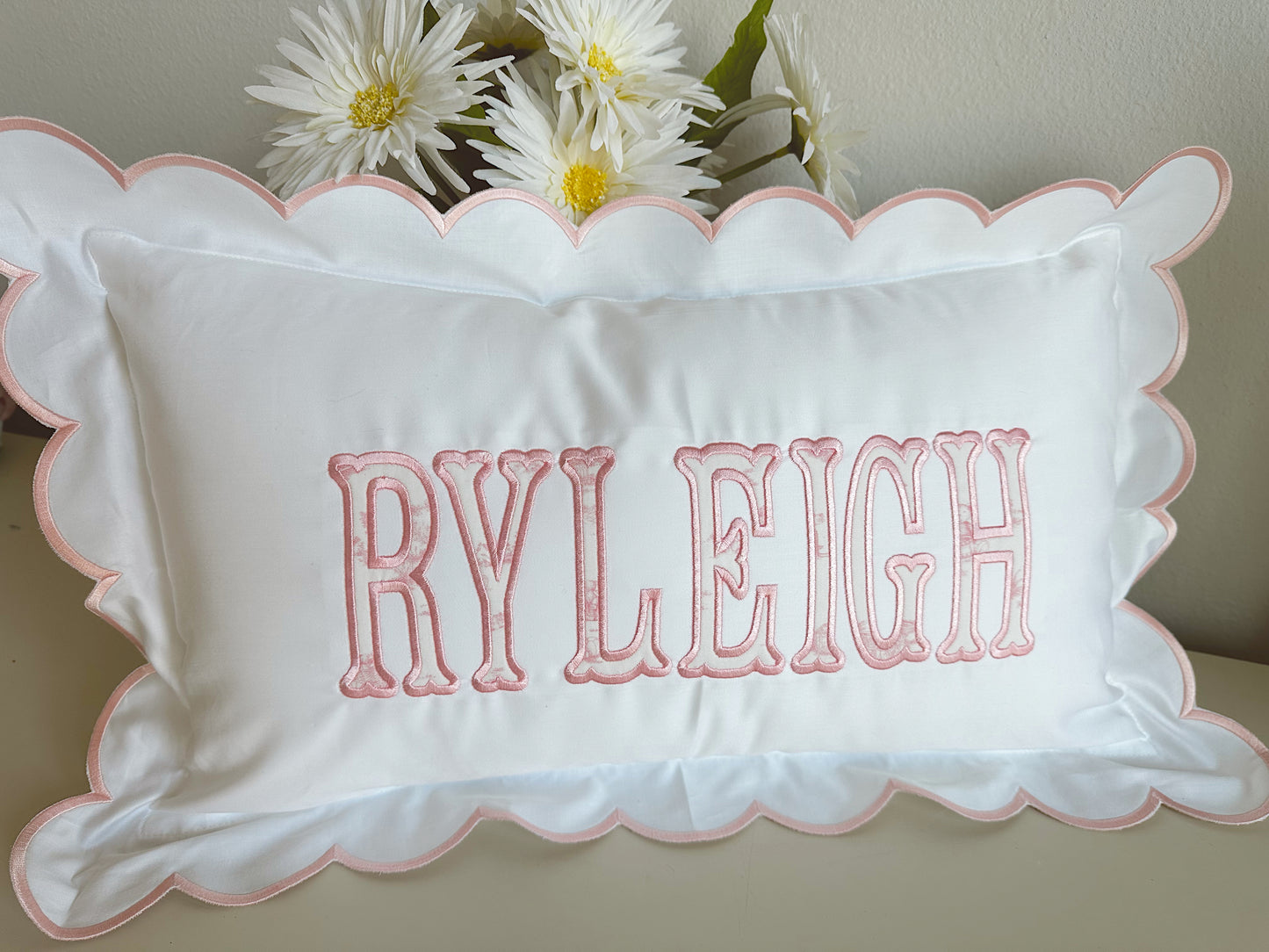 Scalloped nursery pillow