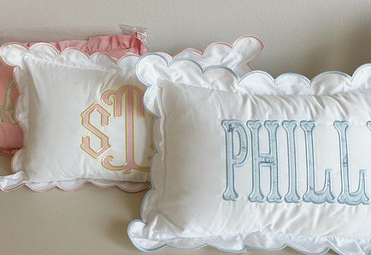 Scalloped nursery pillow