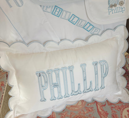 Scalloped nursery pillow